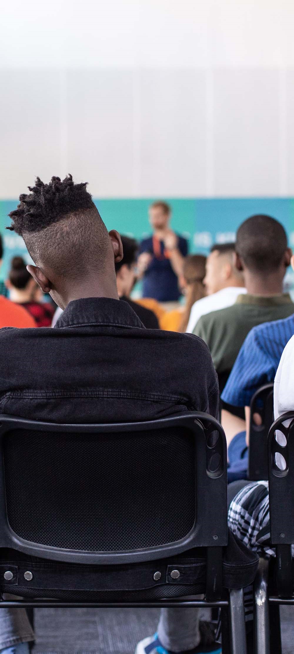 Students sitting in class watching a presentation.