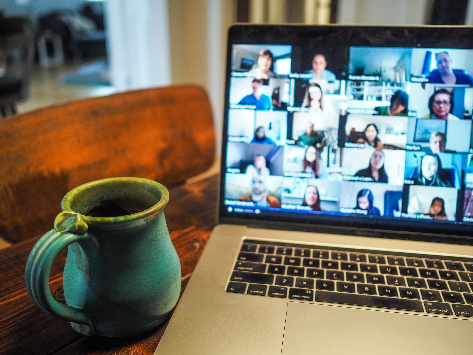 Laptop that is on a table with a mug in front of it