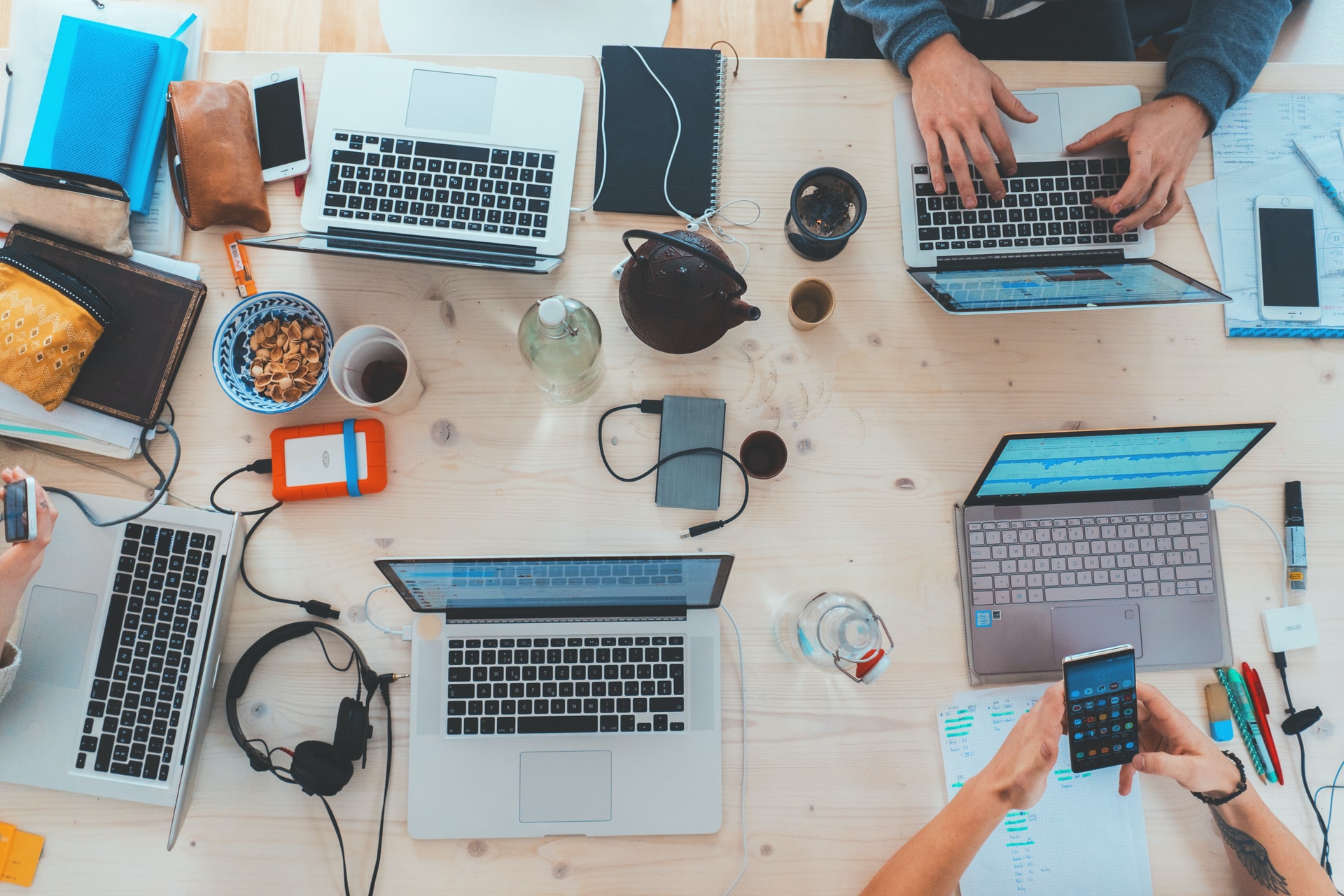 People working together on laptops at a table